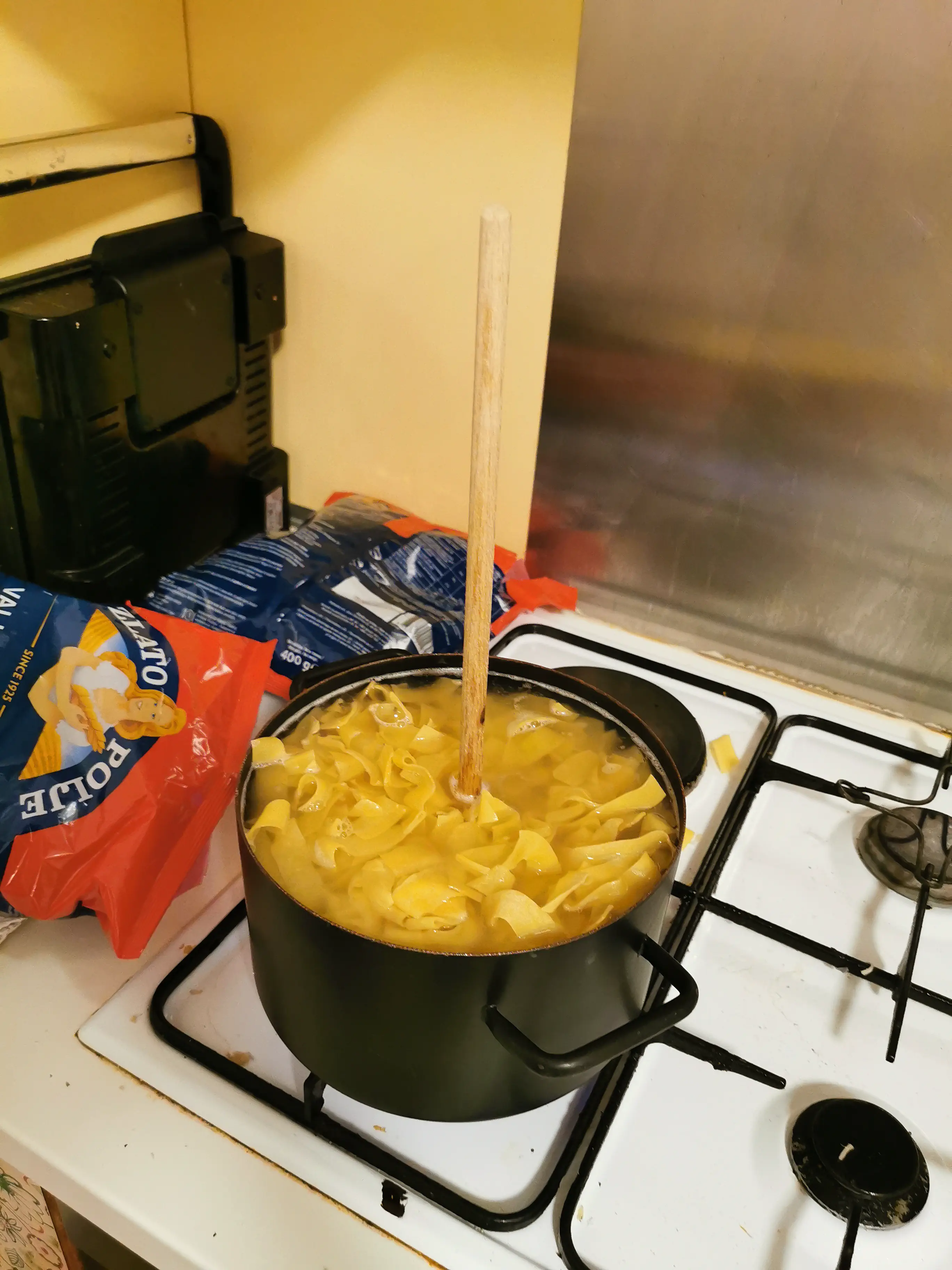 A cooking pot full of pasta